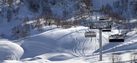Panoramic view on chair-lift and snowy off-piste slope in winter day. Caucasus Mountains. Tetnuldi, Svaneti region of Georgia.

の写真素材