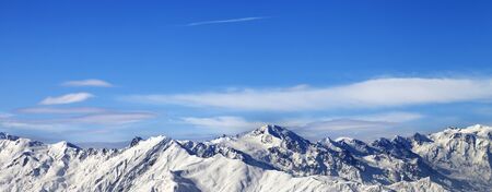 Snowy mountains and blue sky with clouds in nice sunny day. Caucasus Mountains at winter. Svaneti...