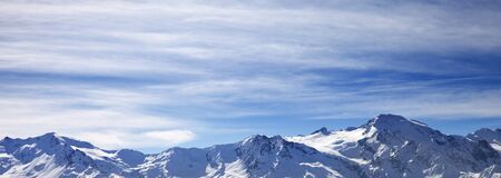 Panoramic view on sunlight snowy mountains in wind winter morning. Caucasus Mountains. Georgia,...