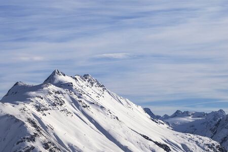 Snowy high winter mountains and beautiful cloudy sky. Italian Alps. Livigno, region of Lombardy, Italy, Europe.の写真素材