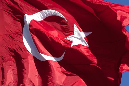 Turkish flag waving in wind at sunny day. Close up view.の写真素材