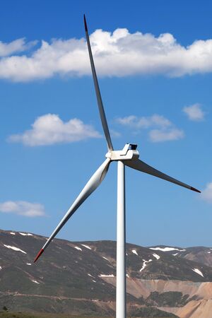 Wind turbine and mountain at sunny day. Close-up view.の写真素材