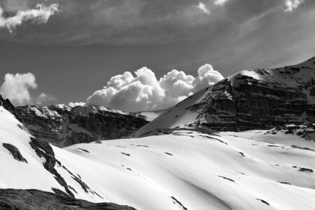 Snowy rocks and cloudy sky at evening mountains. Turkey, Central Taurus Mountains, Aladaglar (Anti...