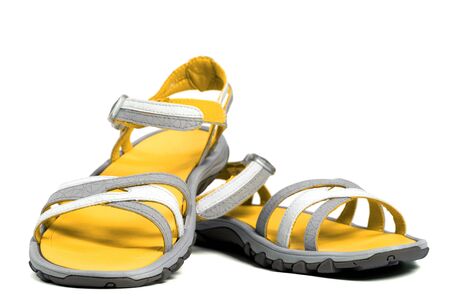 Pair of yellow summer sandals. Isolated on white background.の写真素材