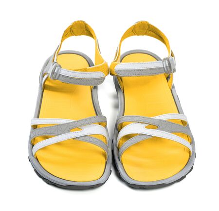 Pair of yellow summer sandals. Isolated on white background. Front view.の写真素材