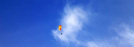 Skydivers in blue sky at sun day. Panoramic view.の写真素材