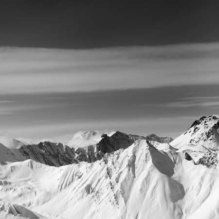 Black and white view on snowy high mountains in winter. Caucasus Mountains, Georgia, region Gudauri.の写真素材