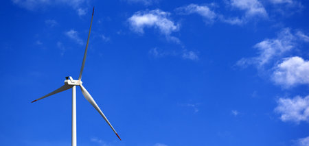 Wind turbine and blue sky with clouds at sun day. Panoramic view.の写真素材