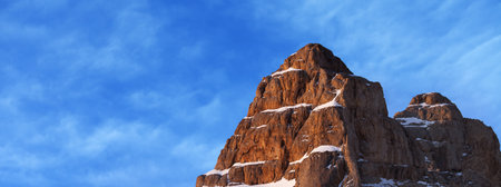 Top of high rocky mountain with snow at beautiful sunrise. Turkey, Central Taurus Mountains, Aladaglar (Anti-Taurus). Panoramic view. Remote location.の写真素材