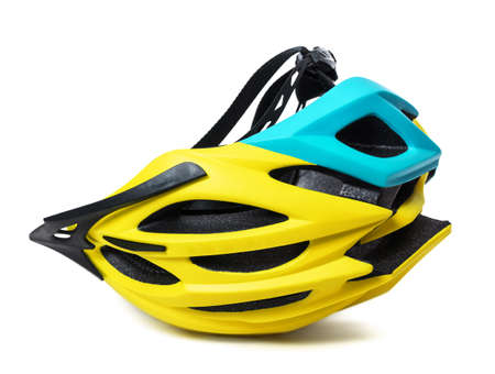 Yellow bicycle helmet upside-down isolated on white backgroundの写真素材