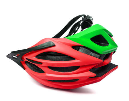Red and green bicycle helmet upside-down isolated on white backgroundの写真素材