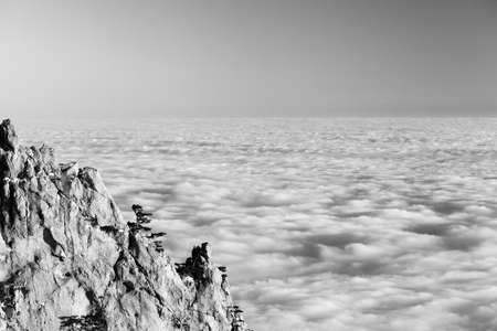 Evening rocks and sea in clouds. Crimean mountains, Ukraine. Black and white toned landscape. High contrast.の写真素材