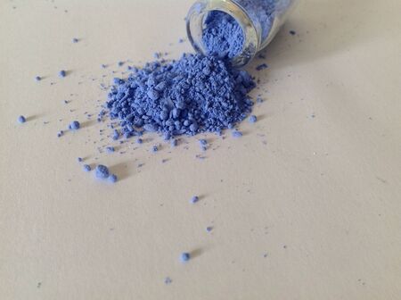 Colored powder on white paperの素材