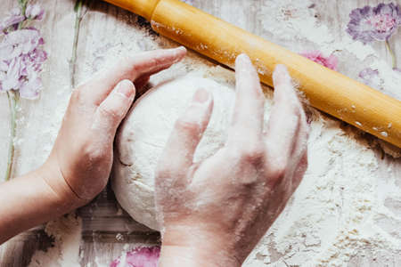 DIY pizza. homemade pizza step by step instruction.pizza step 1 roll out the pizza dough.の写真素材
