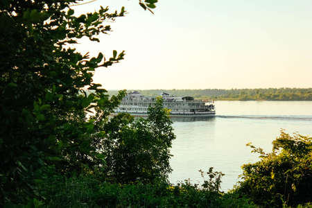 Volga river view from the shore.motor ship on the Volga river view from the shore. Volga River Day...