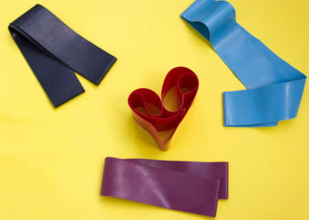 home sports equipment. Fitness and pilates gum. Pilates equipment flatly. Elastic expander. Sport and health concept.love sport.の写真素材