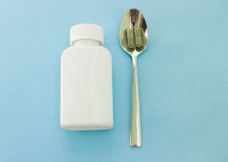 Chlorella in capsules super food. vegetable dietary Supplement Chlorella.capsules and bottle.の写真素材