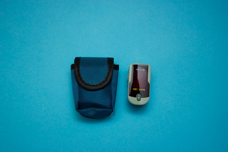 pulse oximeter with case. measuring her oxygen saturation with a pulse oximeter. Health concept.