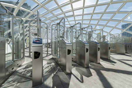 THE HAGUE, 29 July 2018 - The Hague CS metro station toll gate under a sunny sunlight waiting for travelersのeditorial素材