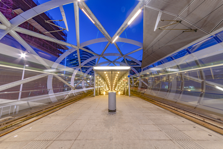 The Hague Beatrixkwartier tram station platform illumated at night waiting for passengers during the blue hour, The Hague, Netherlandsの写真素材