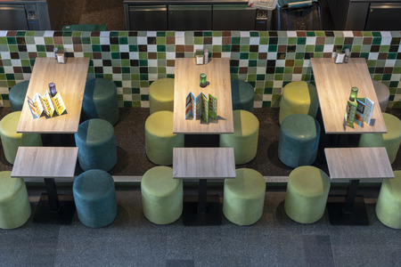 ROTTERDAM, 13 April 2019 - Up down view of three empty table of a restaurant inside the Markthal...