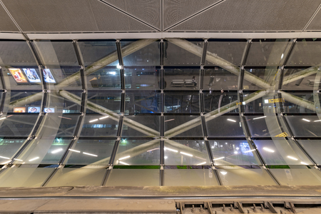 The Hague Beatrixkwartier tram station platform illumated at night waiting for passengers during the blue hour, The Hague, Netherlandsの写真素材