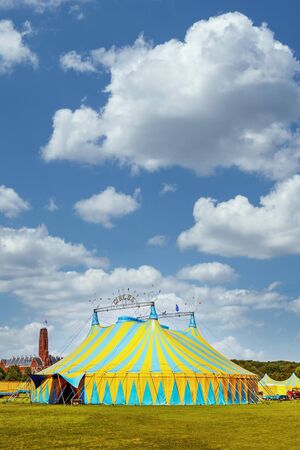 Vertical view of a circus tent under a warn sunset and chaotic skyの写真素材