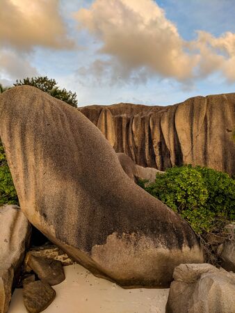 Amazing tropical beach Anse Source d'Argent with granite boulders at sunset, La Digue Island, Seychellesの写真素材