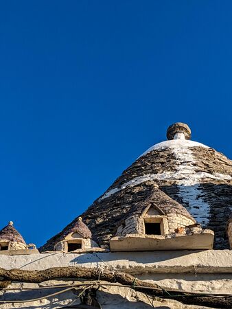 Close up of traditional conical, dry stone roofed trulli house in Alberobello in Puglia, Southern...