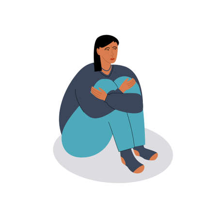 Young sad woman sitting on the floor and hugging herself. Vector flat illustration with an upset person on white backgroundのイラスト素材