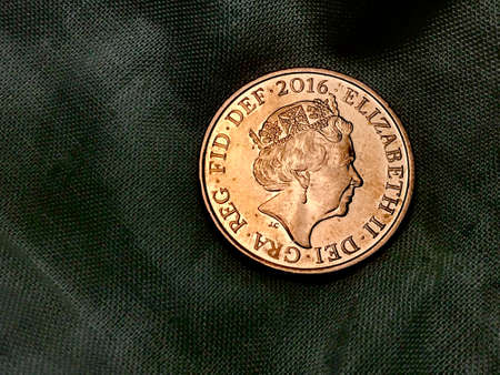 british united kingdom penny coin standing with queen elizabeth faceの写真素材