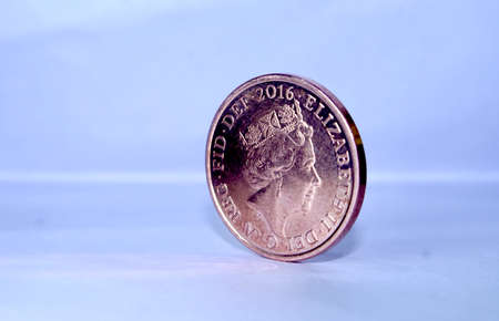 british united kingdom penny coin standing with queen elizabeth faceの写真素材