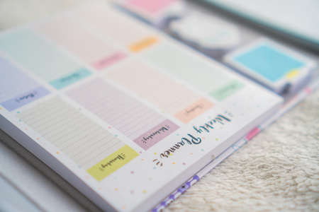 colorful planner and notebook on a white backgroundの写真素材