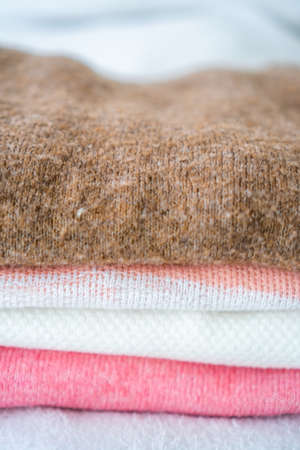 stack of pink and white clothes