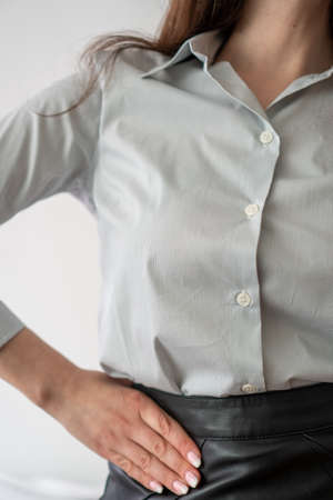 girl in office clothes: leather skirt and white shirt