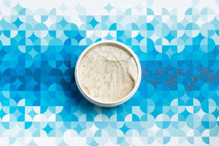 face skin care products scrub on an interesting blue backgroundの写真素材
