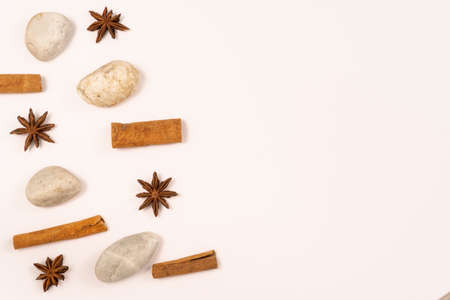 White background with natural elements: stones and anise starsの写真素材
