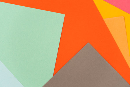 interesting background folded of colored paper leaves of different colorsの写真素材