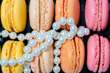 French desserts macarons and necklace white pearl jeweleryの写真素材