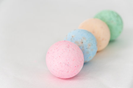bathroom bombs green, pink, cream and blue on a white backgroundの写真素材