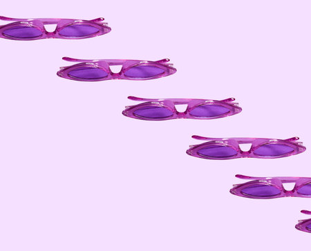 Pattern: sunglasses of bright purple color on a purple backgroundの写真素材