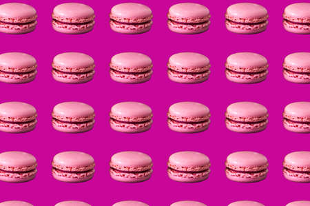 food pattern of french desert macarons on a violet backgroundの写真素材
