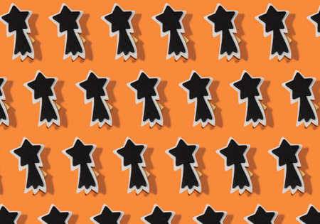 Creative pattern photo of decorative products: orange background and stars decor for homeの写真素材