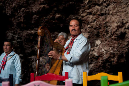 Mexican band playing in a cave restaurantのeditorial素材