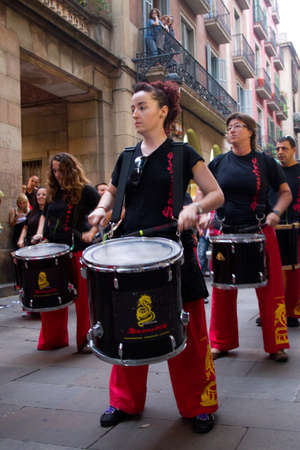 BARCELONA - JULY 17: Drum players at Festa Major del Raval Festival on July 17, 2011 in Plaça del Bonsucces, Raval, Barcelona, Spainのeditorial素材