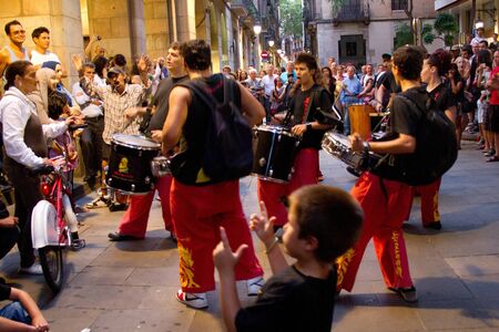 BARCELONA - JULY 17: Drum players at Festa Major del Raval Festival on July 17, 2011 in Plaça del Bonsucces, Raval, Barcelona, Spainのeditorial素材