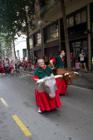 BARCELONA - JULY 17: Giants and big heads (Gigantes y Cabezudos) in Festa Major del Raval Festival on July 17, 2011 in Raval, Barcelona, Spainのeditorial素材