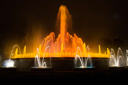 BARCELONA - JULY 25: Tourists at the Magic Fountain of Montjuïc (Font màgica de Montjuïc) and Palau Nacional on the Montjuïc, near Plaça dのeditorial素材