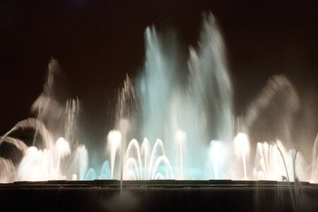 BARCELONA - JULY 25: Tourists at the Magic Fountain of Montjuïc (Font màgica de Montjuïc) and Palau Nacional on the Montjuïc, near Plaça d'Espanya on July 25, 2011 in Barcelona, Spainのeditorial素材