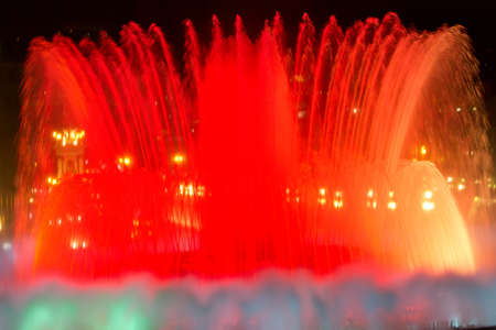 BARCELONA - JULY 25: Tourists at the Magic Fountain of Montjuïc (Font màgica de Montjuïc) and Palau Nacional on the Montjuïc, near Plaça d'Espanya on July 25, 2011 in Barcelona, Spainのeditorial素材